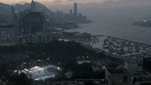 an aerial view of a city with a large body of water