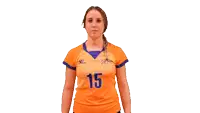 a woman wearing an orange jersey with the number 15 on the front