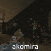 a man in a tuxedo is standing next to a woman in a blue dress with the word akomira on the bottom right