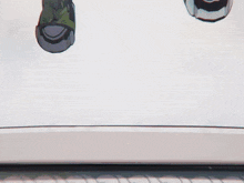 a close up of a person 's feet wearing a pair of green and black shoes