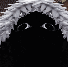 a close up of a person 's face with a black background