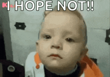 a baby is making a funny face with the words `` i hope not '' written on it .