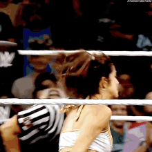 a woman in a wrestling ring with the next big thing written on the bottom of the image