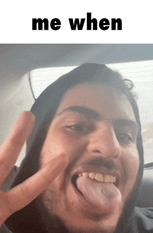 a man sticking his tongue out with the words me when behind him