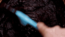 a person is mixing semisweet chocolate chips in a cup