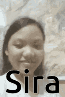 a close up of a girl 's face with the word sira on it