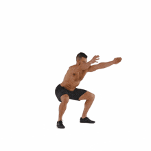 a shirtless man in black shorts is doing a squat