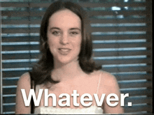 a woman says whatever while holding a cake