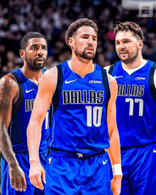 three dallas basketball players are standing together