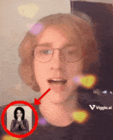 a man wearing glasses has a picture of a woman behind him