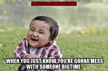 a baby in a plaid shirt is laughing with the caption " when you just know you 're gonna mess