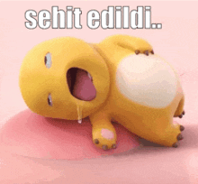a cartoon character is laying on its back with its mouth open and the words " sehit edildi " written above it