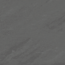 a close up of a gray surface with a gold swirl