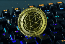 a gold coin with the letter e on it sits on top of a keyboard