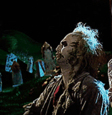a man in a zombie costume is looking up at the sky