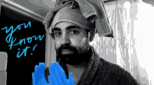 a man with a towel wrapped around his head and the words you know it written in blue
