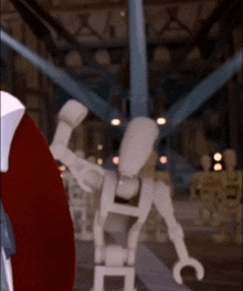 a lego figure is standing in a dark room with a red circle in the background
