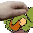 a hand is petting a cartoon character with a green hat .