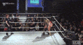 two women are wrestling in a ring with a crowd watching and a sign that says gew london