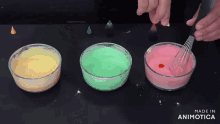 three bowls of different colored liquid with the words made in animatica on the bottom right