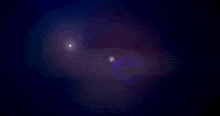 a purple and blue background with a glowing light in the middle