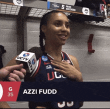 a woman in a ucsd jersey is being interviewed