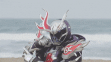 a person in a purple and white costume with a red circle on it