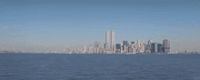a city skyline with the twin towers visible