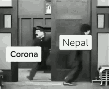 a black and white photo of a man standing in front of a door with a sign that says corona and nepal