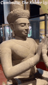 a statue of a man with the words cambodia the khmer igs written above it