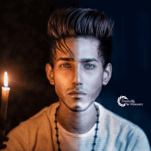 a photo of a young man with a candle and the words freeze for moments below it