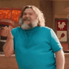 a man with a beard wearing a blue shirt