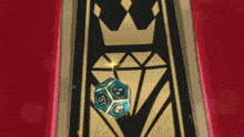 a blue dice with hearts on it is sitting in front of a crown and diamond on a red background .