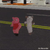 a pig and a cat are standing next to each other on a street