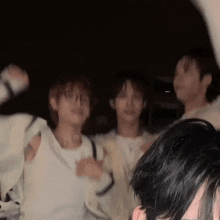 a blurry photo of a group of people dancing