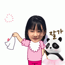 a girl holding a piece of paper next to a panda