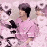 a man in a pink shirt is surrounded by pink hearts and says juwoncito de valy