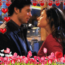 a picture of a man and a woman with flowers and hearts surrounding them with the words picmix at the bottom