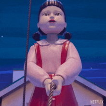 a statue of a girl holding a rope with a netflix logo in the corner