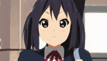 a girl with a cat ear on her head has a serious look on her face