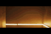 a corner of a room with a light on