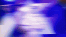 a blurry image of a person 's face against a blue background