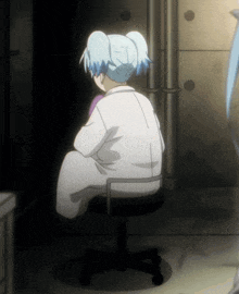 a girl with blue hair is sitting on a chair