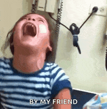 a child is screaming with his mouth wide open and the words by my friend written on the bottom