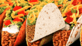 a close up of a taco with a tortilla on top of it