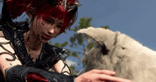 a woman with blood on her face petting a white animal