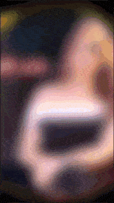 a blurred image of a person 's face with a few lines