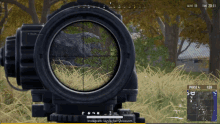 a video game screen shows a sniper aiming at a rock in a field