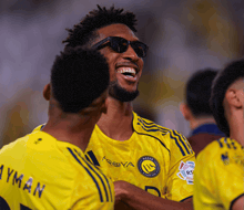 a soccer player wearing sunglasses and a jersey that says proya on it