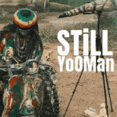 a poster for still yooman shows a man riding a scooter in the dirt